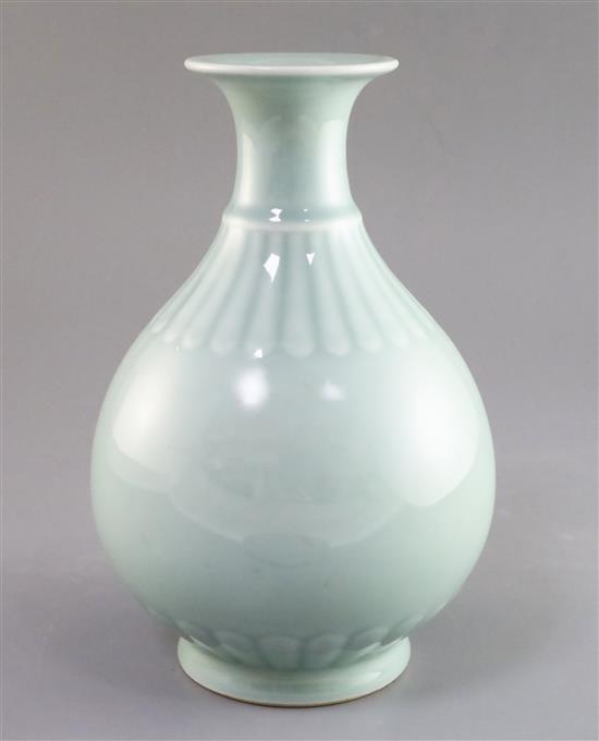 A Chinese celadon glazed bottle vase, yuhuchunping, Qianlong seal mark, perhaps Qing dynasty, H. 24.5cm, hairline crack to foot